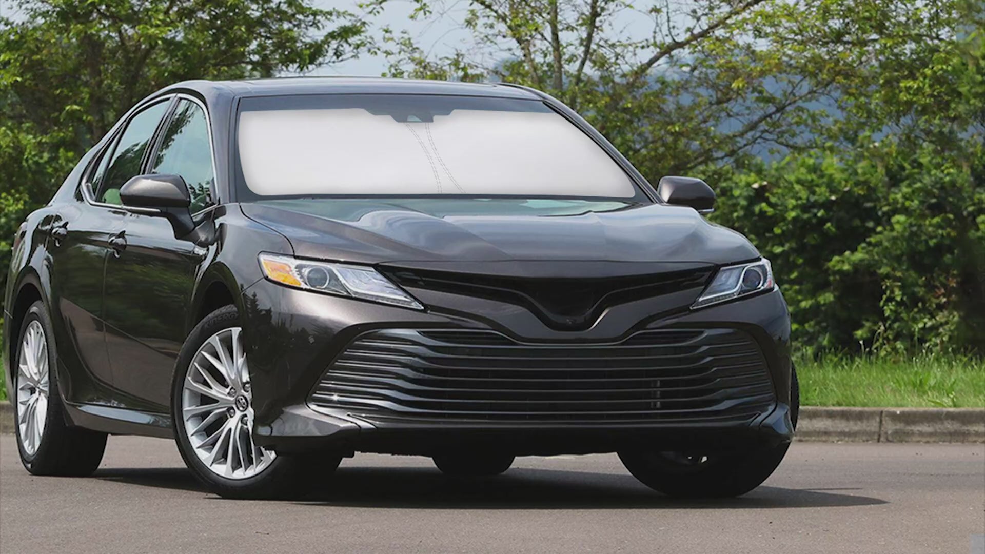 Windshield sun shade for Toyota Camry 2012-2017, custom fit foldable sun shield screen, car window sun visor protector, blocks UV rays, keeps car interior cooler, front windshield sunshade for Toyota Camry, heat reducing sun blocker, automotive sun protection accessory, vehicle sun visor cover, foldable sun shield for sedan, car sunshade for Toyota Camry